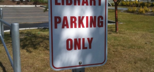 A sign says "Library Parking Only"